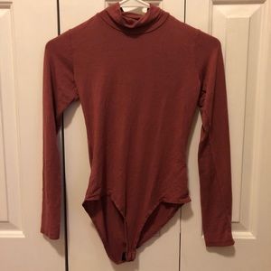 Turtle neck body suit with open back